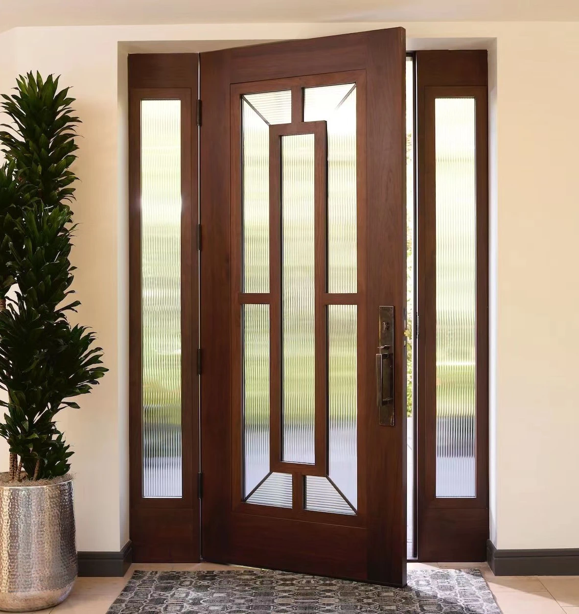 Elegant solid wood door with glass sidelights and geometric ribbed glass inserts, offering natural light and privacy for luxury homes.