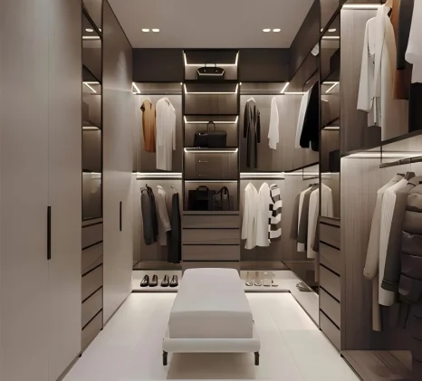 Architectural walk-in closet design highlighting modular shelving, soft-close drawer banks, and structural aluminum framework engineered by George Homes.